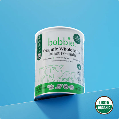 Bobbie Organic Whole Milk Infant Formula container on a blue background